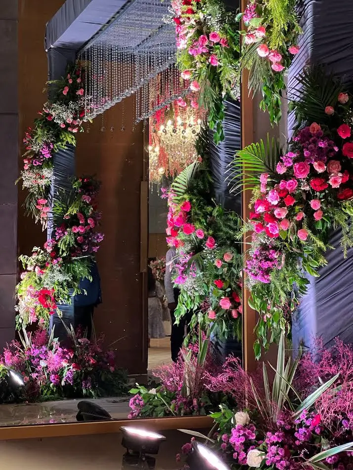 Pink floral pillar decor for a wedding stage